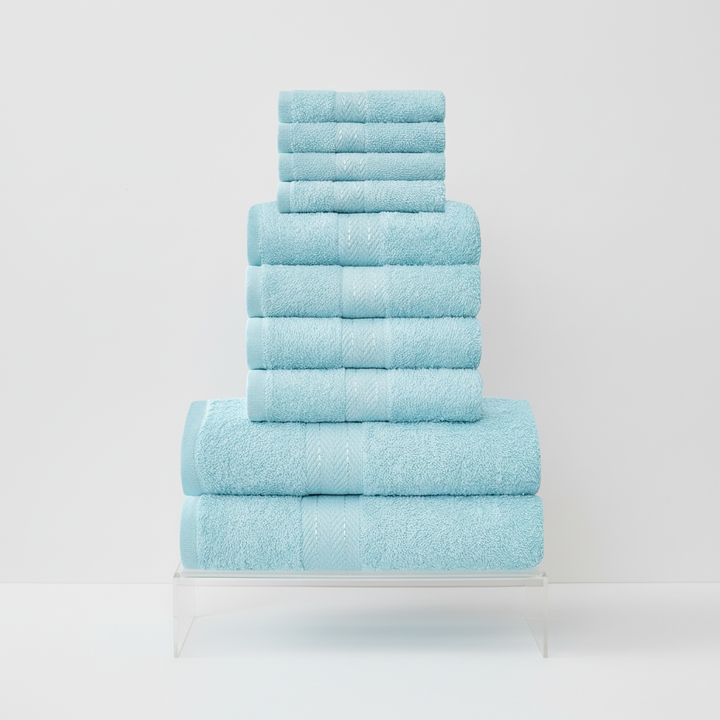 Absorbent cotton bath towel draped over a rack, showing its plush loops and elegant design, premium home textile.