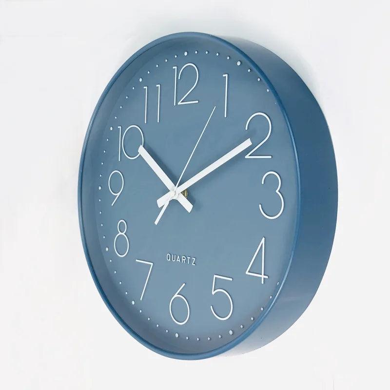 Minimalist modern 12-inch round wall clock. Quiet quartz movement, ideal for contemporary home decor.