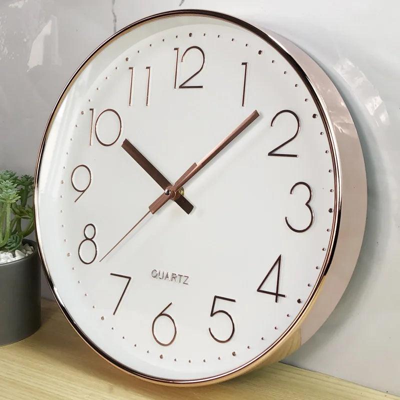 Round 12-inch wall clock with quiet quartz movement. Modern design, perfect for minimalist home decor.