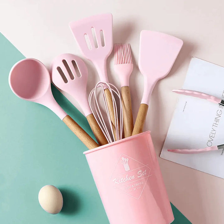 Durable silicone whisk for baking accessories from a 12-piece kitchen utensil set, heat-resistant.