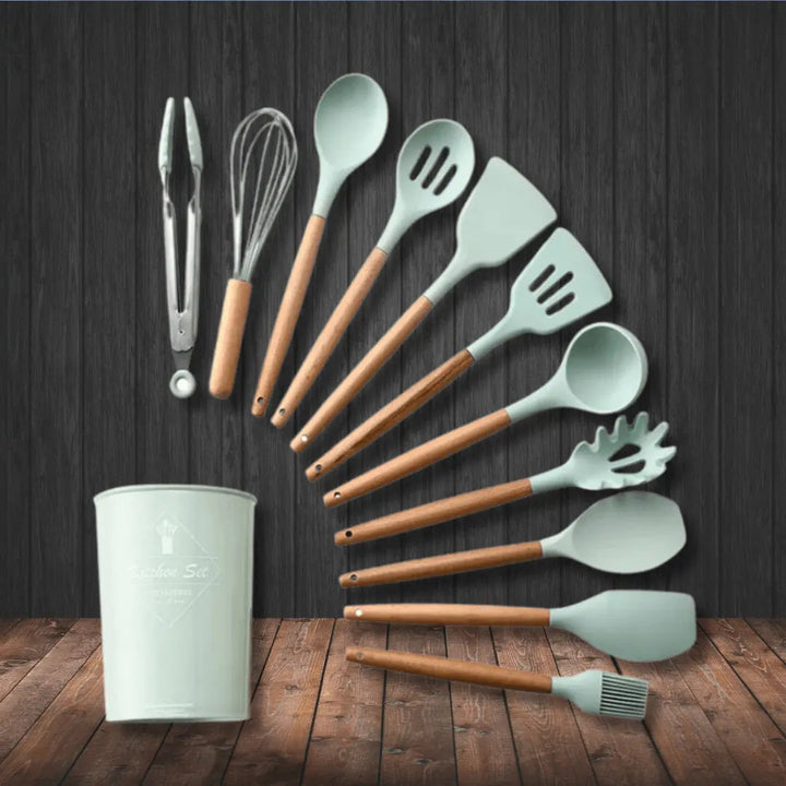 Variety of silicone kitchen utensils including spatulas, ladles, & whisks from 12-piece cooking tool set.