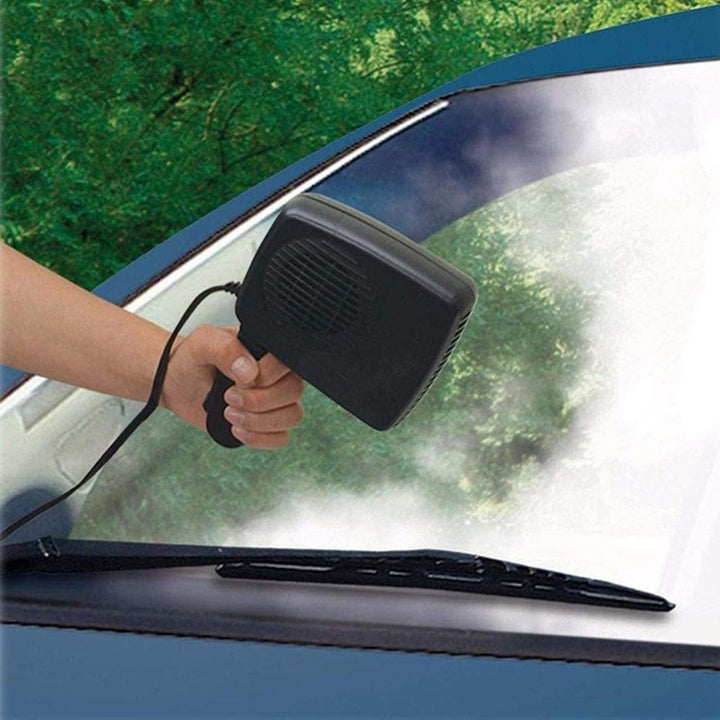 Portable 12V car heater fan mounted on a dashboard, ready to defrost windshield & warm vehicle cabin.