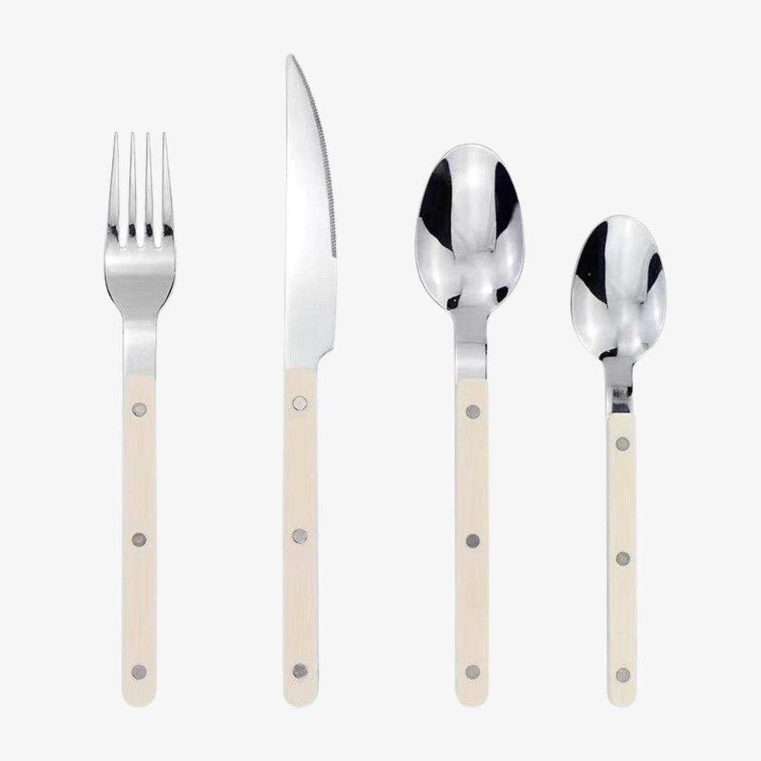 Stylish engraved stainless steel 24-piece cutlery set, enhances any dinnerware.