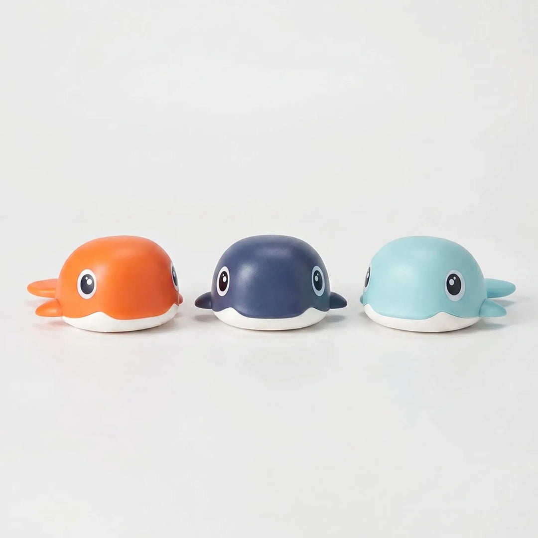 Wind-up floating whale bath toys for kids, perfect for engaging bathtime play and water fun for children.