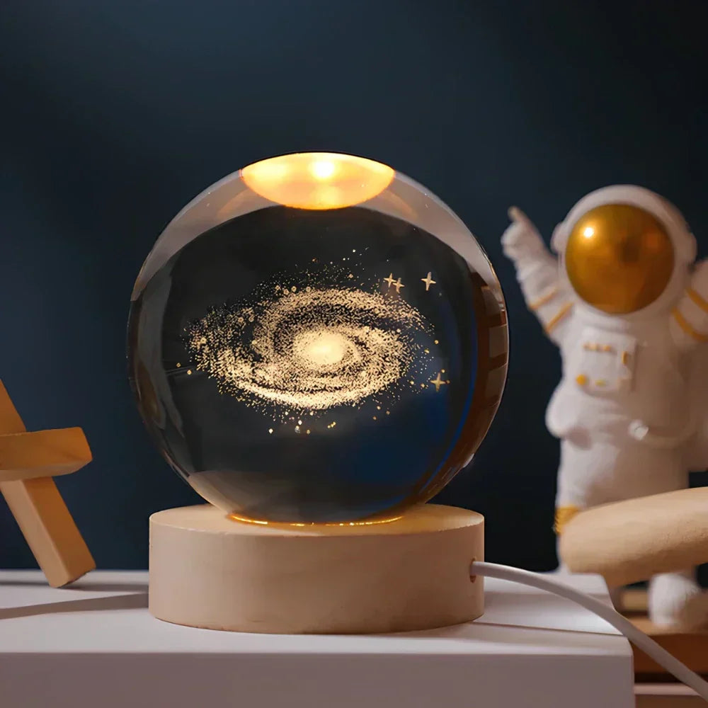 Close-up of a 3D engraved crystal sphere night light, showcasing intricate Celestia space patterns