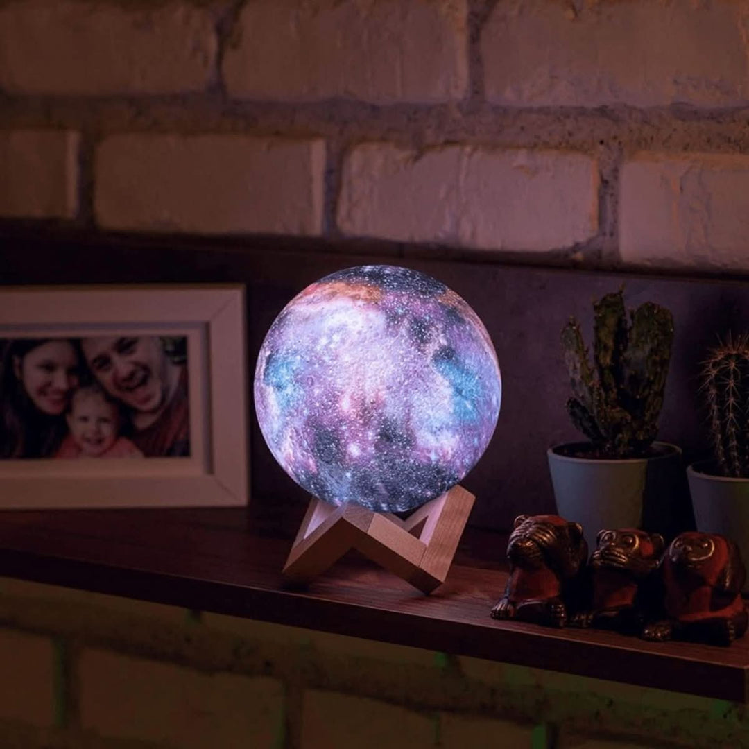 Stunning home decor accent: 16-color LED galaxy moon lamp, creating perfect mood lighting on a wooden base.