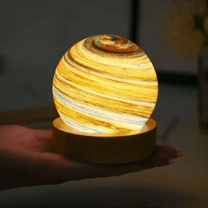 CosmoSphere 3D Mini Planet Lamp with realistic galaxy light effect, creating a celestial ambiance on its wooden base.