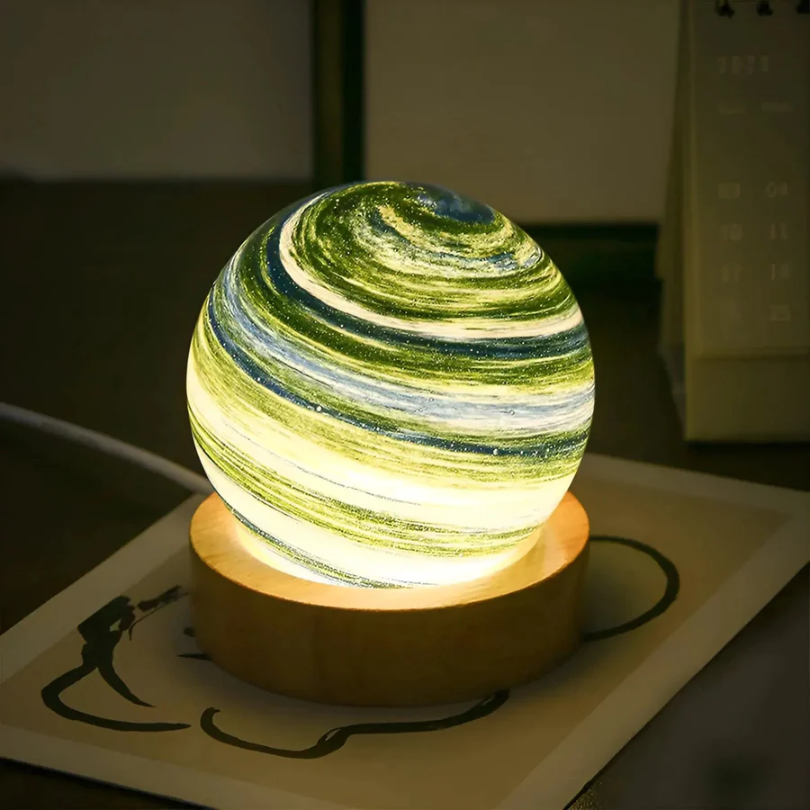 Unique 3D Planet Lamp, the CosmoSphere, with a stylish wooden base. Modern celestial table lamp for any room.