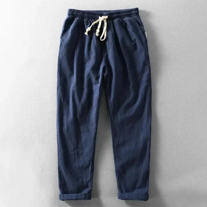 A man wearing relaxed fit Zen trousers, showcasing their comfort and casual style for men.