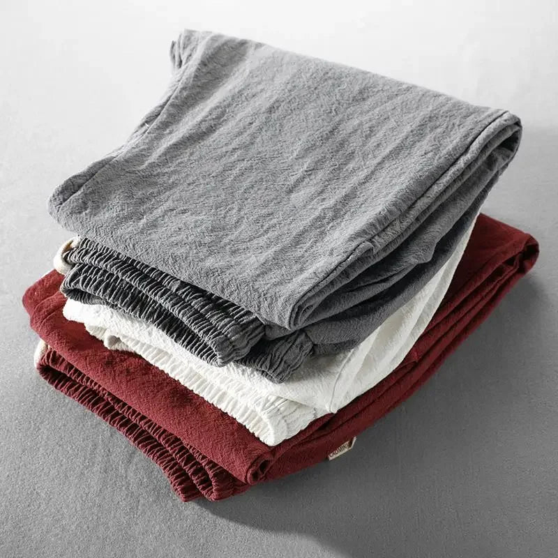 Detail of the comfortable waistband and relaxed leg of men's Zen trousers for everyday wear.