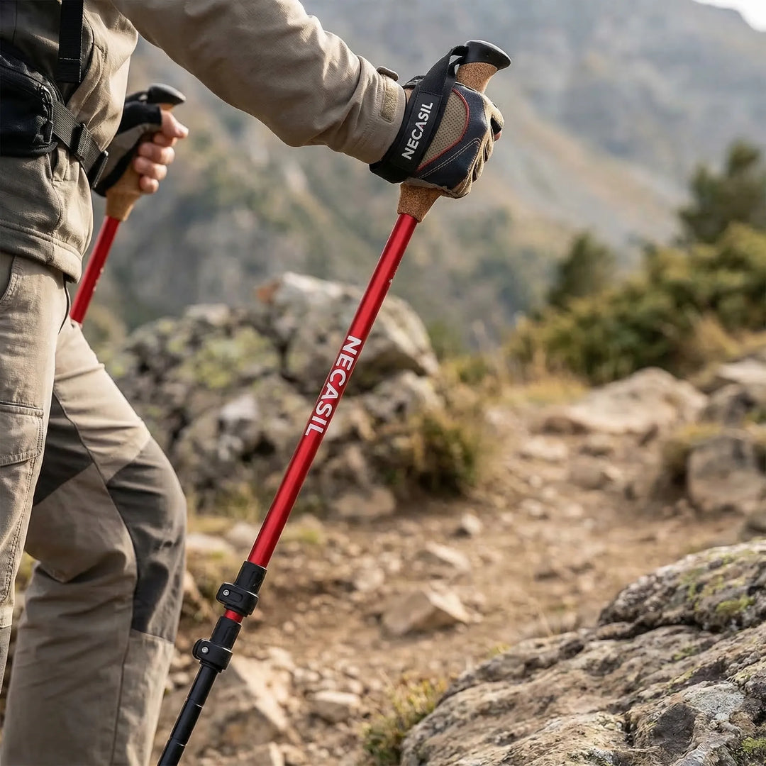 A pair of lightweight unisex adjustable telescoping trekking poles for hiking and outdoor adventures.