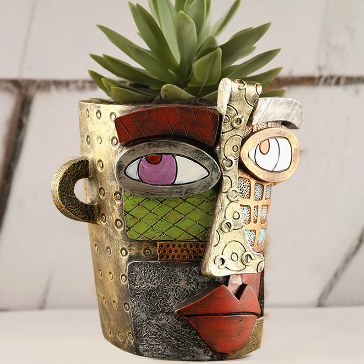 Decorative abstract face planter, perfect for indoor plants or outdoor garden decor.
