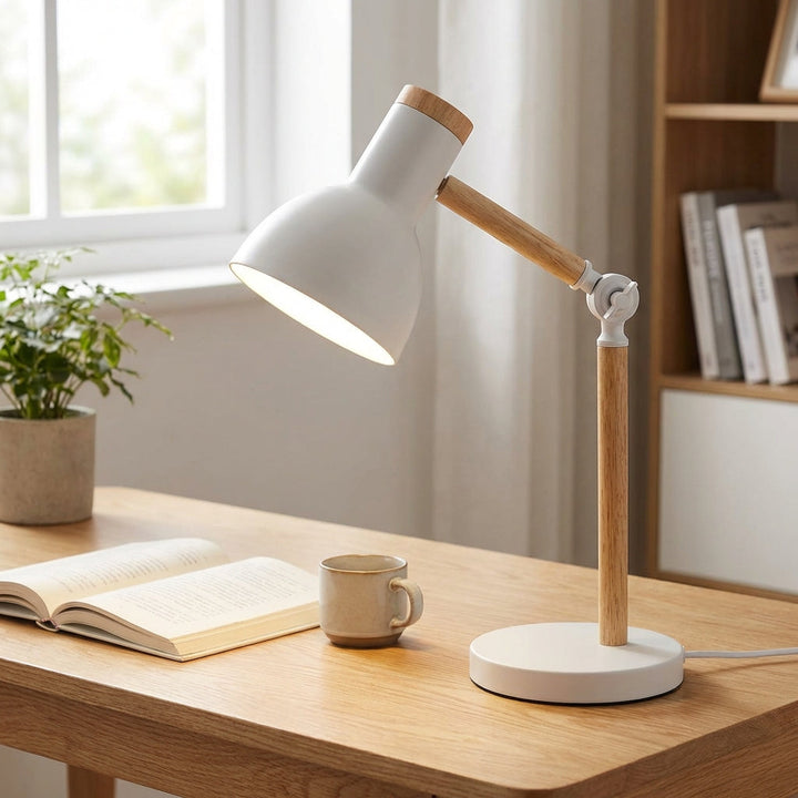 Adjustable Arclume Nordic desk lamp, black metal, angled for task lighting in a modern home office