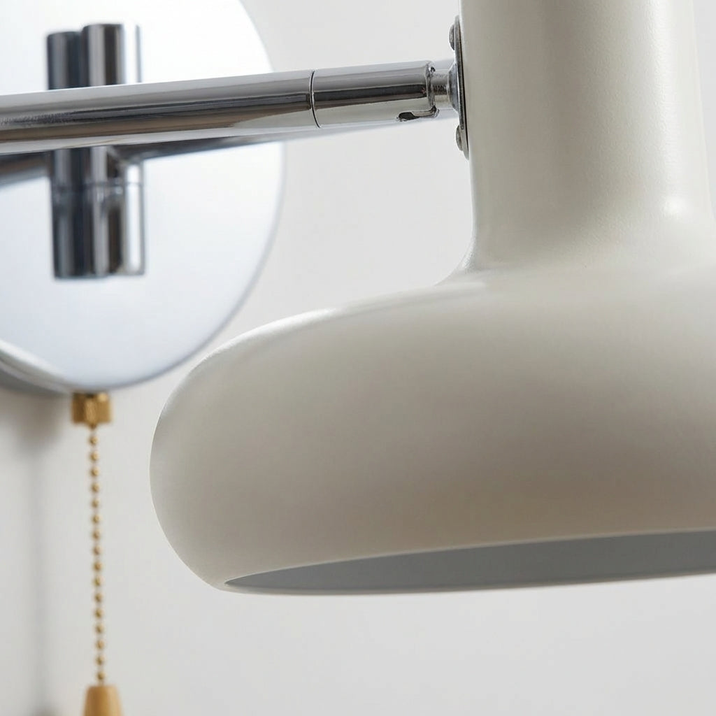 Modern, adjustable swing arm wall sconce in sleek black, a minimalist Bauhaus lighting fixture