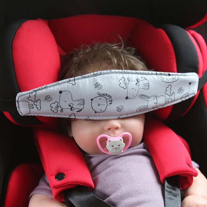 Adjustable car seat head support cushion for kids with cartoon animals on soft fabric, ensuring toddler travel comfort and neck support.