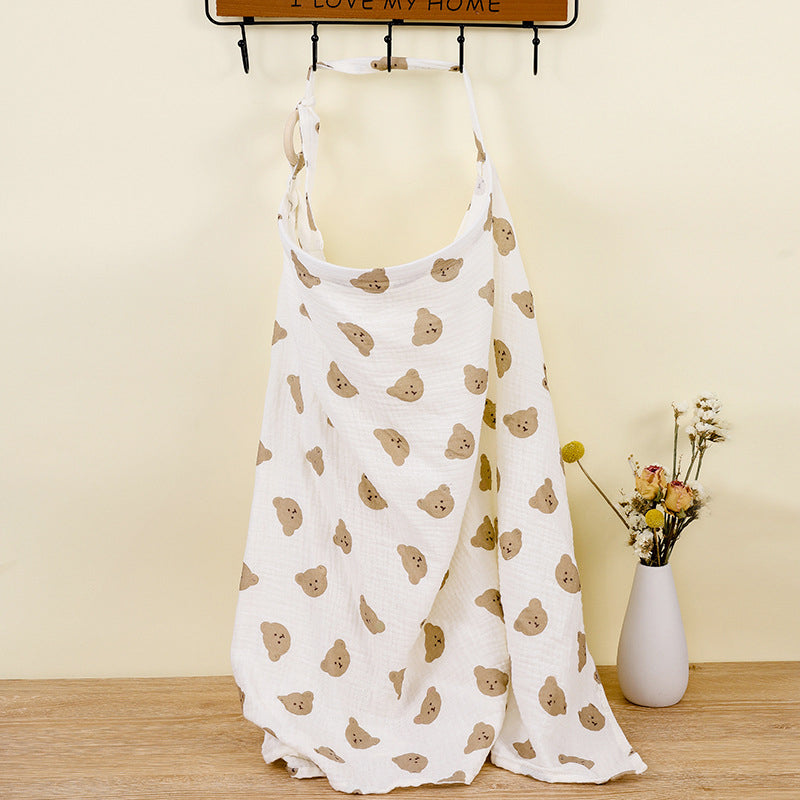 Versatile adjustable nursing cover in cotton, doubles as a stroller blanket for baby.