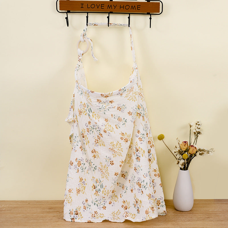 Close-up of the adjustable cotton nursing cover fabric texture and secure neckline.