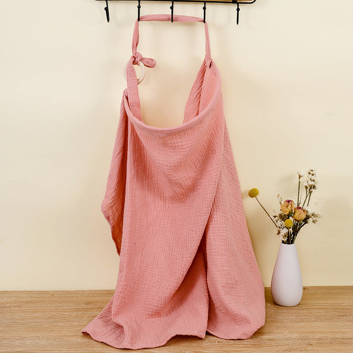 Baby accessories: compact adjustable cotton nursing cover, ideal for breastfeeding discreetly.