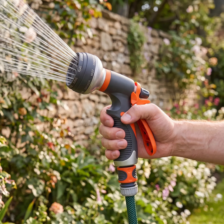 Adjustable garden hose nozzle with 8-pattern spray for versatile watering, car wash & outdoor cleaning.