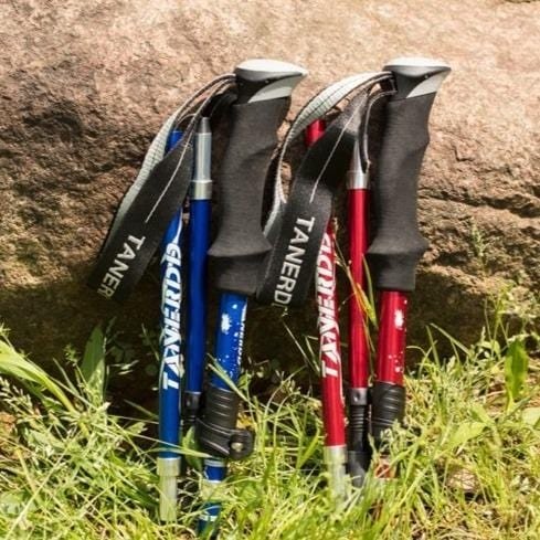 Pair of adjustable telescopic hiking poles. Lightweight outdoor gear for stability & support during trekking & camping.