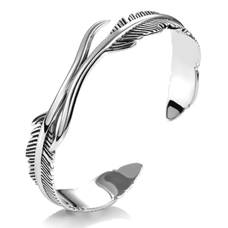 Adjustable silver feather charm bracelet for women, perfect for bohemian or everyday wear.