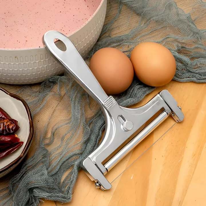 Culinary kitchen gadget: adjustable stainless steel cheese slicer for perfect, uniform food prep.