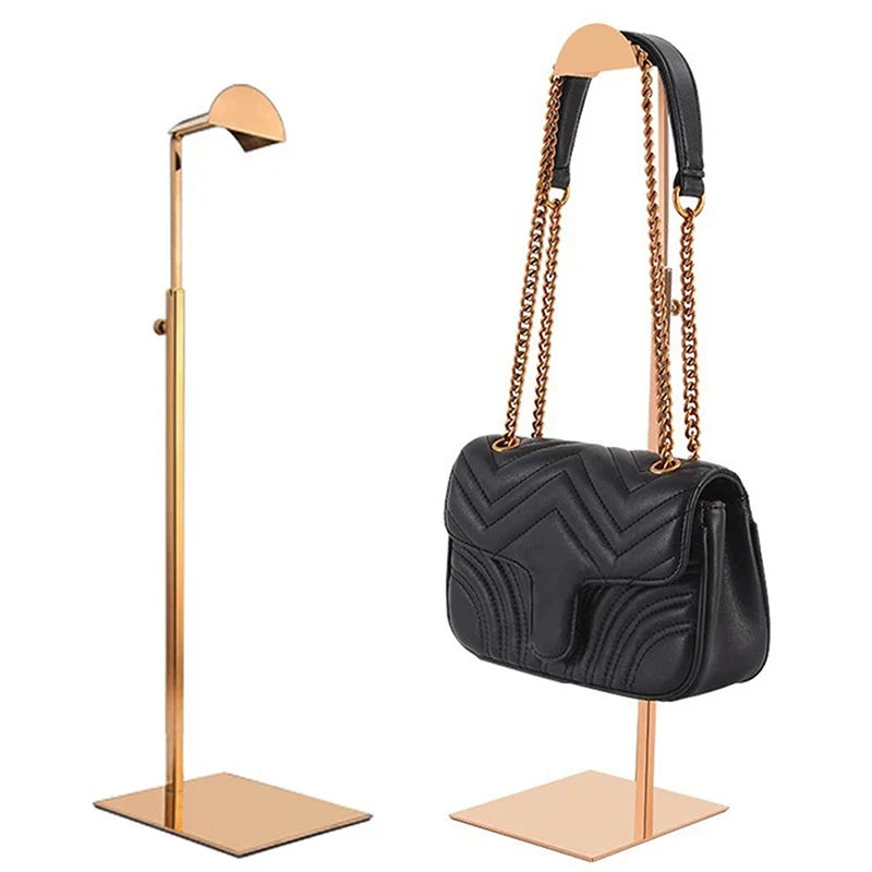 Adjustable stainless steel handbag display stand, perfect for luxury purse organization & retail store fixtures.