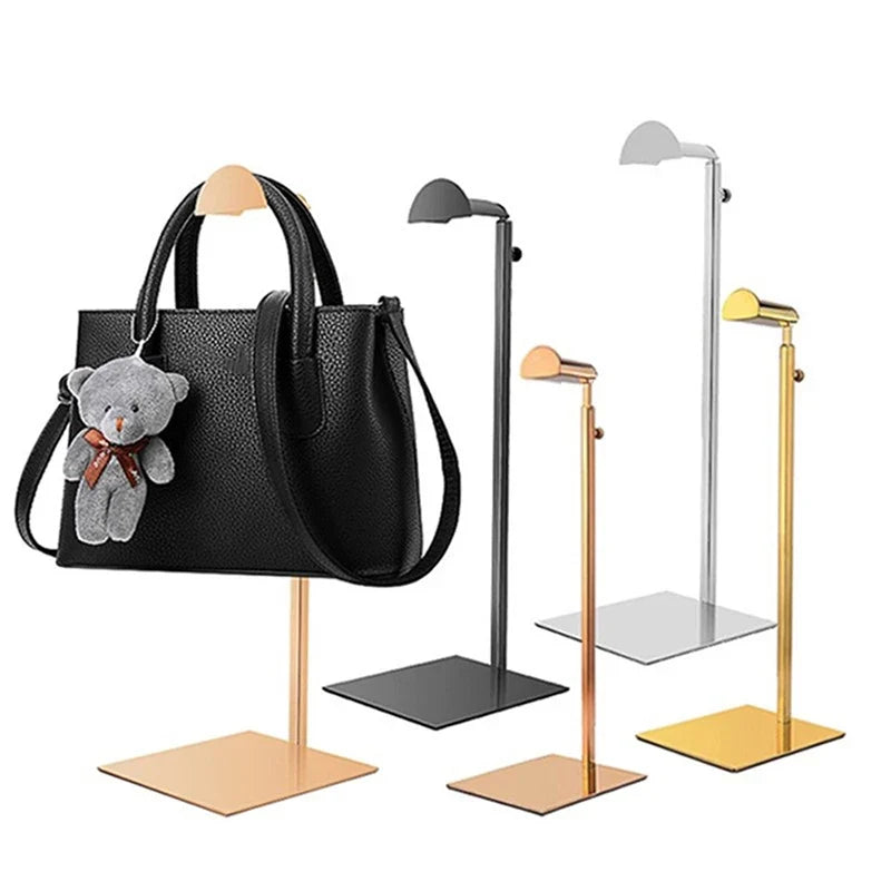 Modern stainless steel adjustable purse display stand, great for showcasing fashion handbags in stores or at home.
