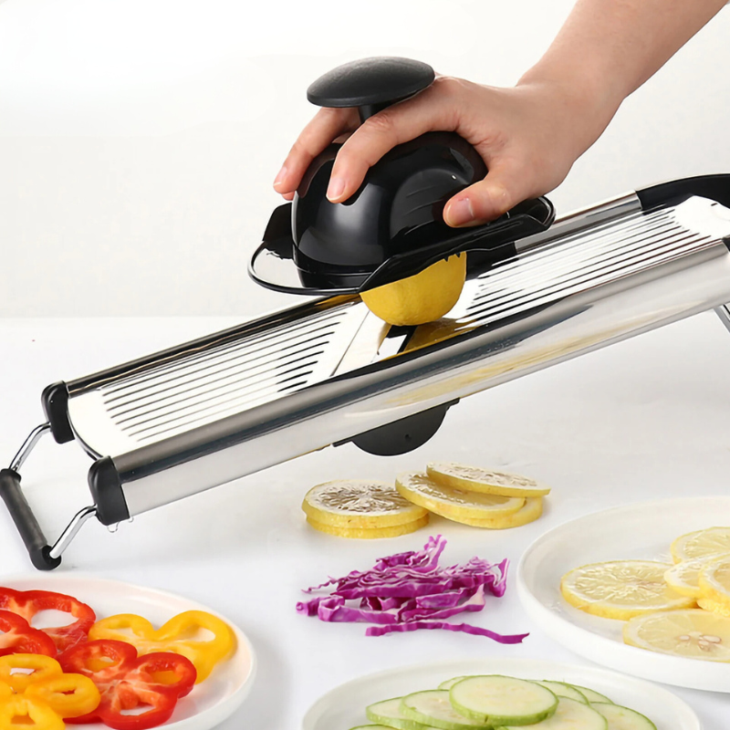 Adjustable stainless steel mandoline slicer for precise vegetable and fruit slicing, a key kitchen tool.