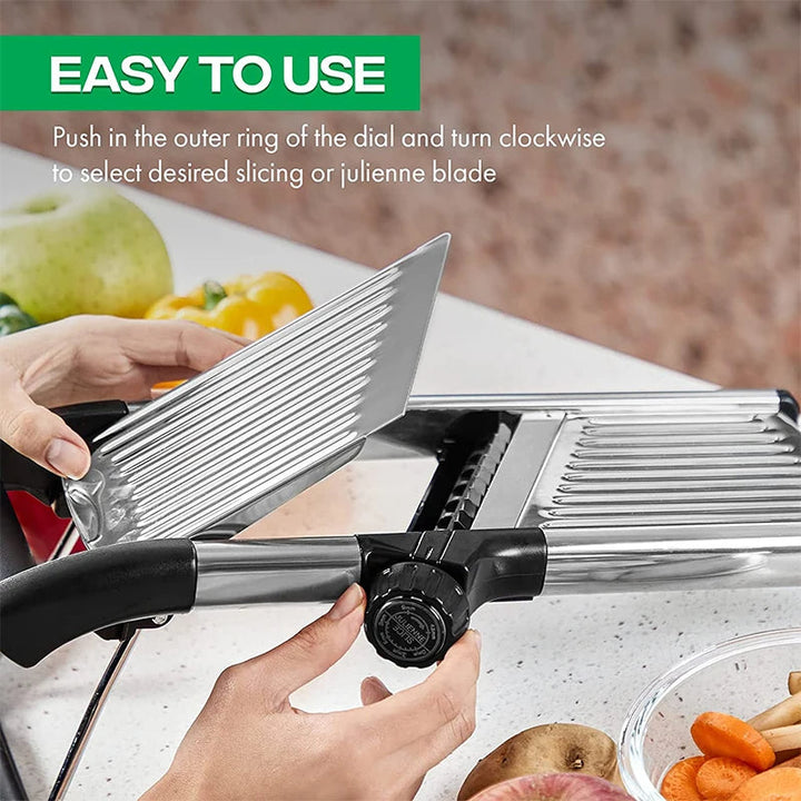 Chef using an adjustable stainless steel mandoline to quickly slice potatoes for gratin or chips.