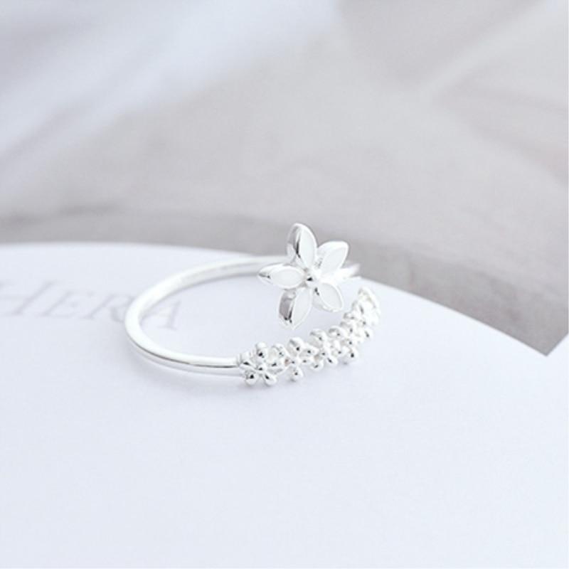 Adjustable sterling silver ring for women with colorful enamel wildflowers. Nature-inspired floral jewelry, perfect gift.