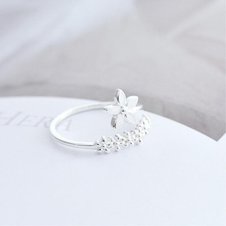 Adjustable sterling silver ring for women with colorful enamel wildflowers. Nature-inspired floral jewelry, perfect gift.
