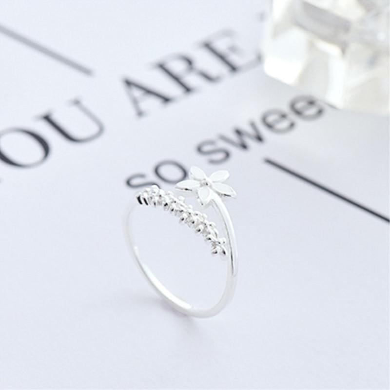 Beautiful women's adjustable silver ring with intricate enamel wildflowers. Ideal floral jewelry gift for her.