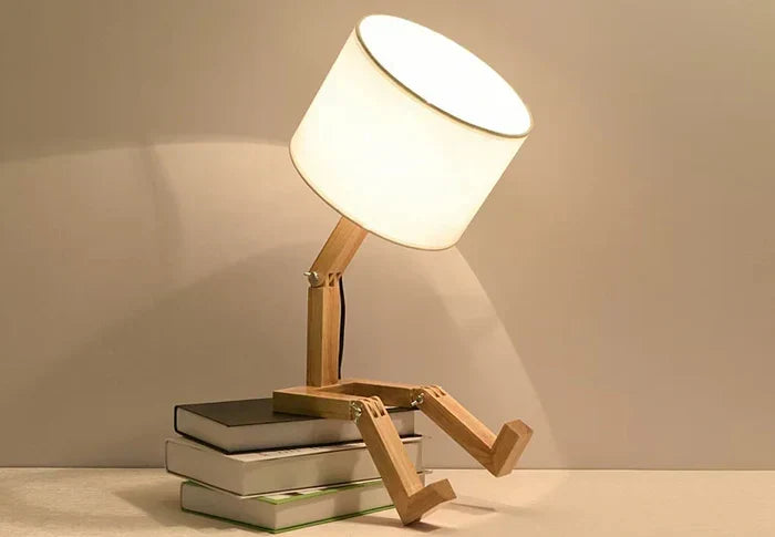 Elegant adjustable wooden reading lamp, features integrated storage for small items on any desk or table.