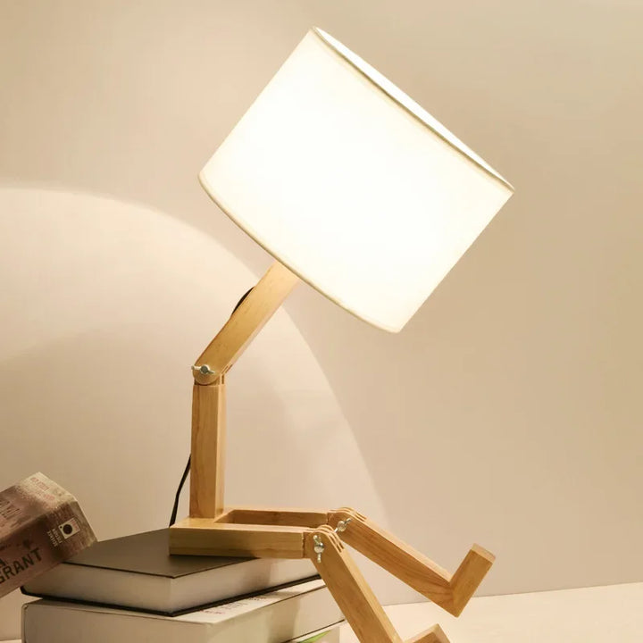 Contemporary wooden desk lamp with an adjustable neck and a handy storage base for a tidy look.