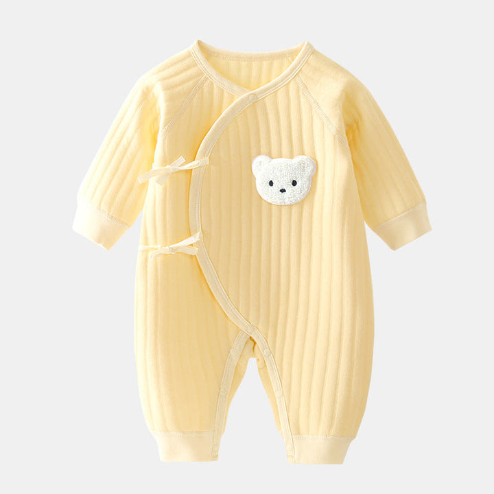 Close-up of a cozy baby bear cotton jumpsuit with snap closures, newborn essentials