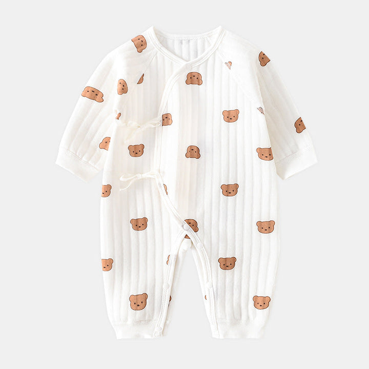 Toddler sitting comfortably in a breathable cotton bear themed romper, soft infant clothing