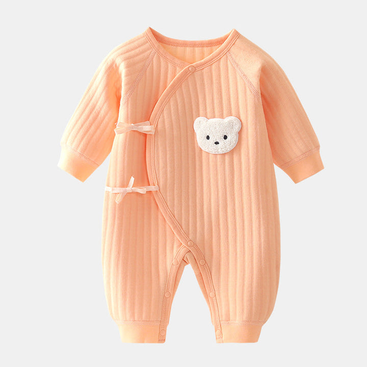 Baby on a blanket wearing a snug cotton bear outfit, perfect for autumn, unisex baby