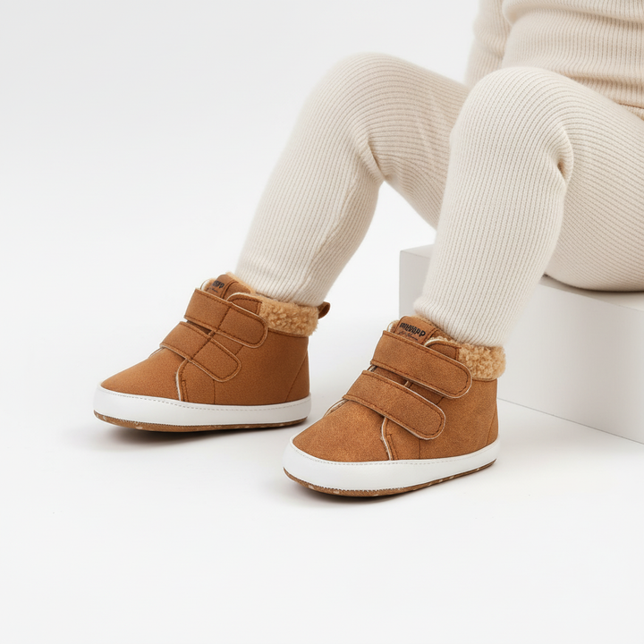 Fleece-lined baby boots with bunny ears, non-slip grip, and practical Velcro enclosures.