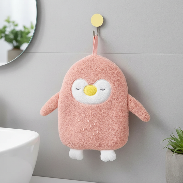 Adorable coral fleece penguin hand towel, super absorbent and quick-drying, perfect for bathroom or kitchen decor.