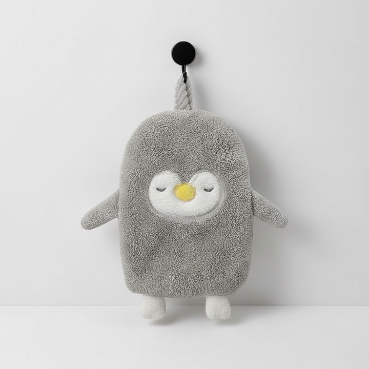 Decorative and functional coral fleece penguin hand towel, an absorbent and fun addition to any home decor.