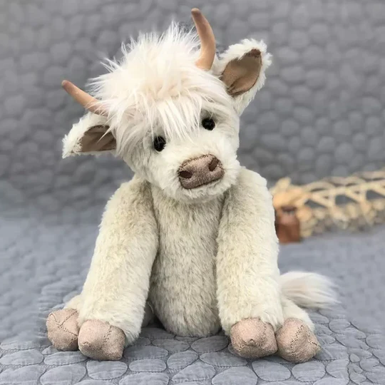 Adorable handmade Highland Cow plush, soft alpaca fur, perfect Scottish gift or children's stuffed animal.