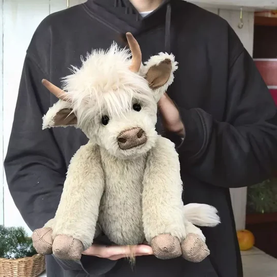 Cute children's Highland Cow plush, handmade with soft fur, unique Scottish stuffed animal present.