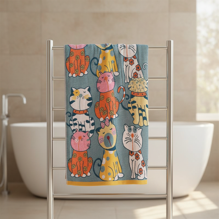 Adorable newborn baby wrapped in a soft, absorbent kitty hooded bath towel, made from cotton.