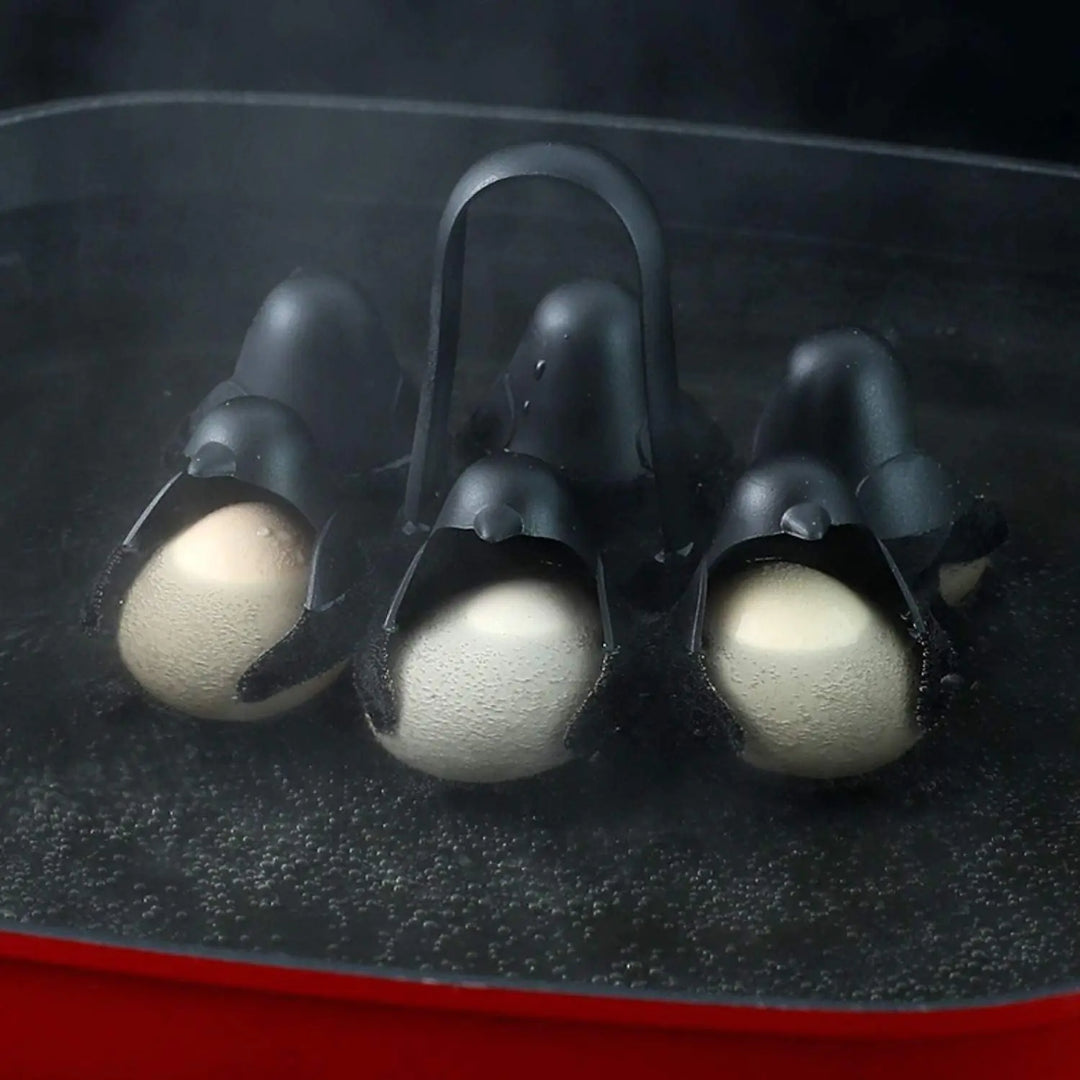 Cute penguin design 3-in-1 egg cooker, a versatile kitchen gadget & breakfast maker for easy home cooking.
