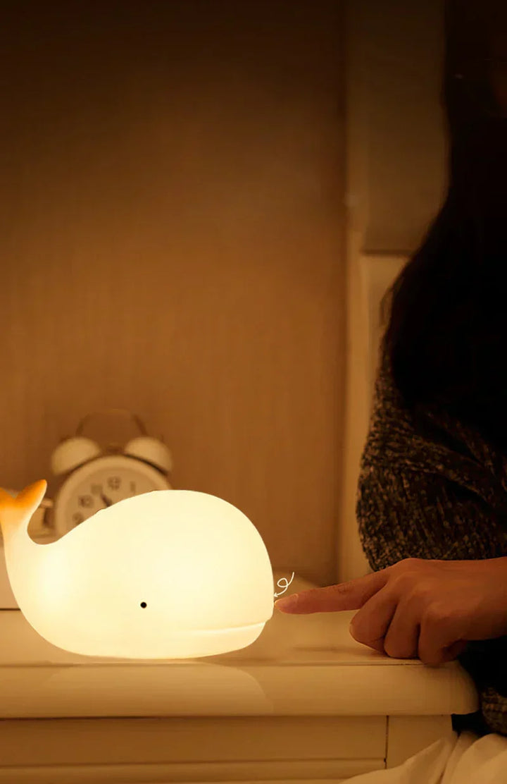 Cute whale night light, a perfect children's gift, providing a calming color-changing glow for bedtime.