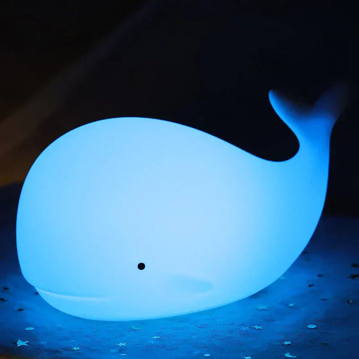 Charming whale night light, a thoughtful children's gift. Features color-changing LED glow for soothing nursery decor.