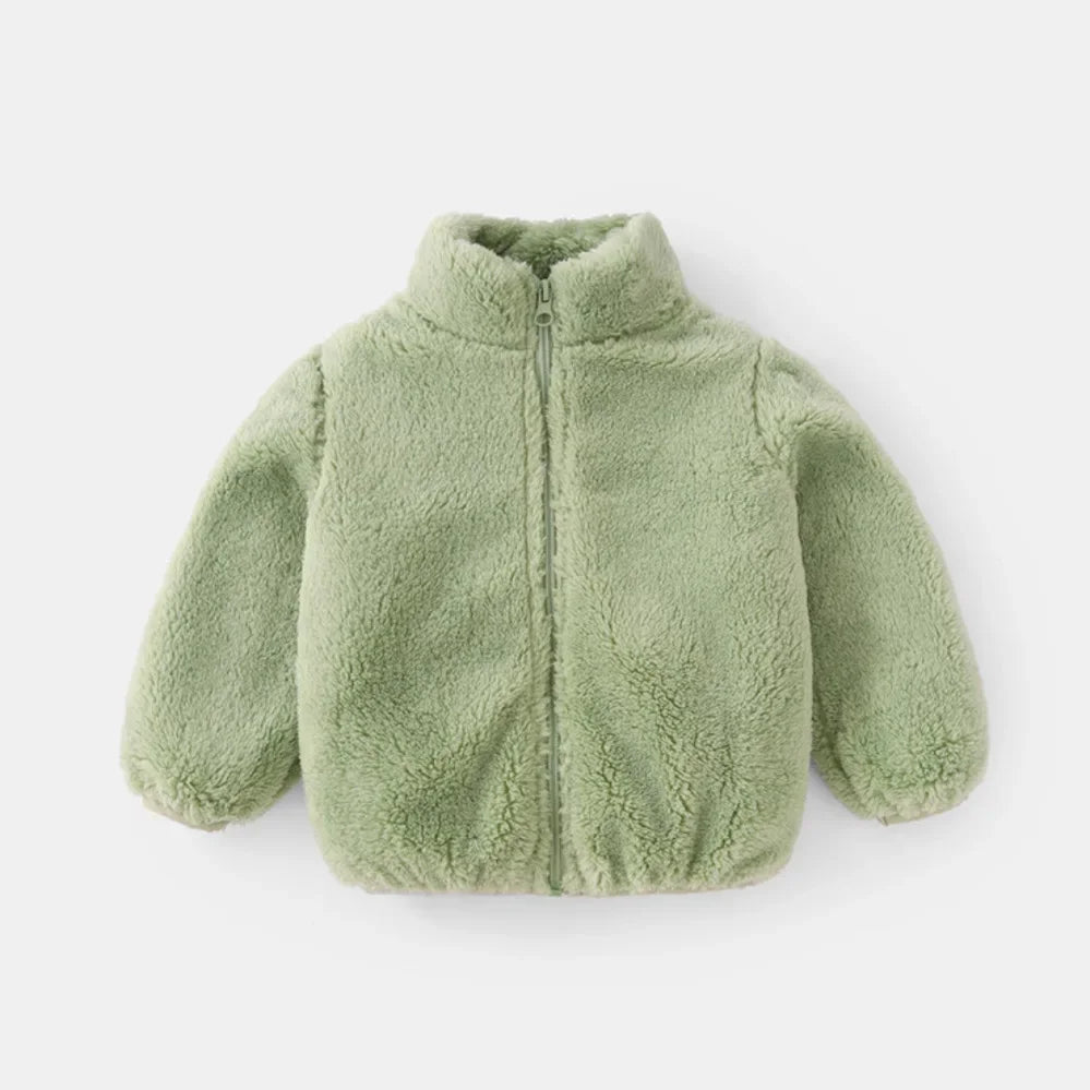 Cozy blue fleece jacket for kids, showcasing its soft texture and practical design for cold weather.