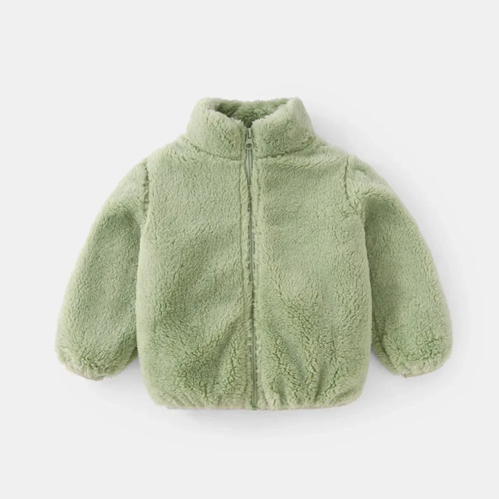 Cozy blue fleece jacket for kids, showcasing its soft texture and practical design for cold weather.