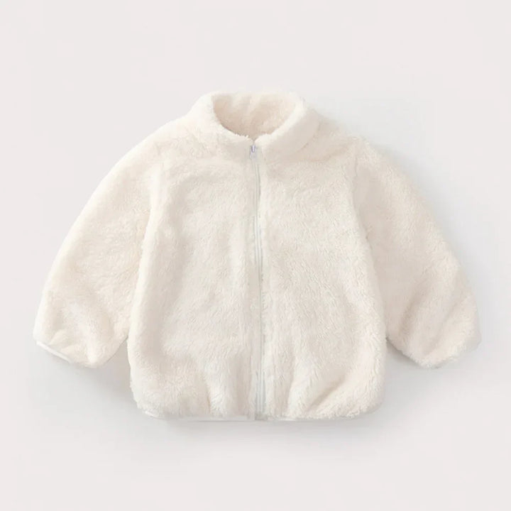 Close-up of a vibrant green kids' fleece coat, highlighting the plush material and quality stitching.